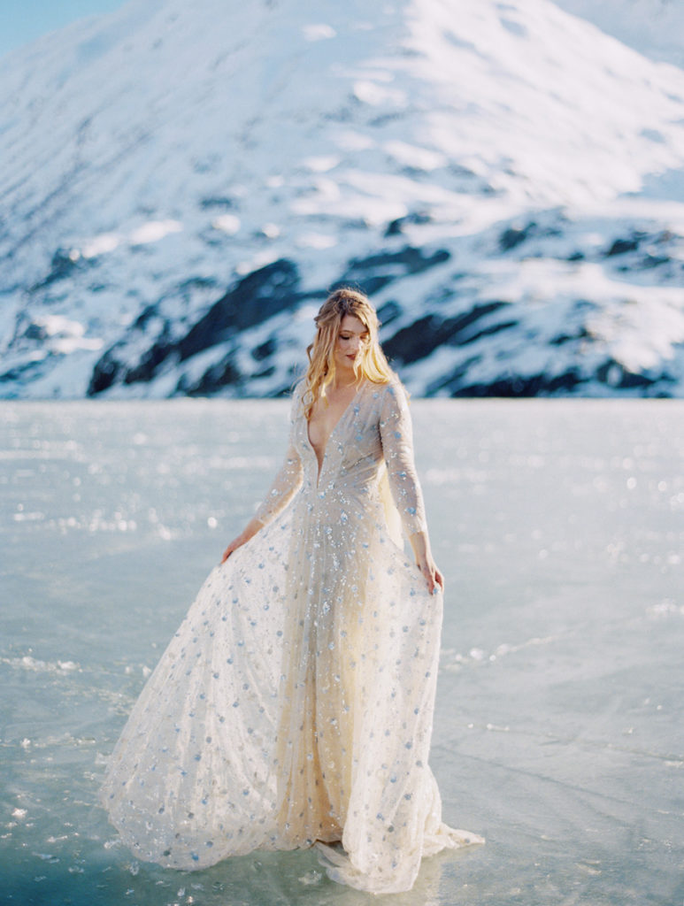 How to elope in Alaska, a bride standing on a glacier