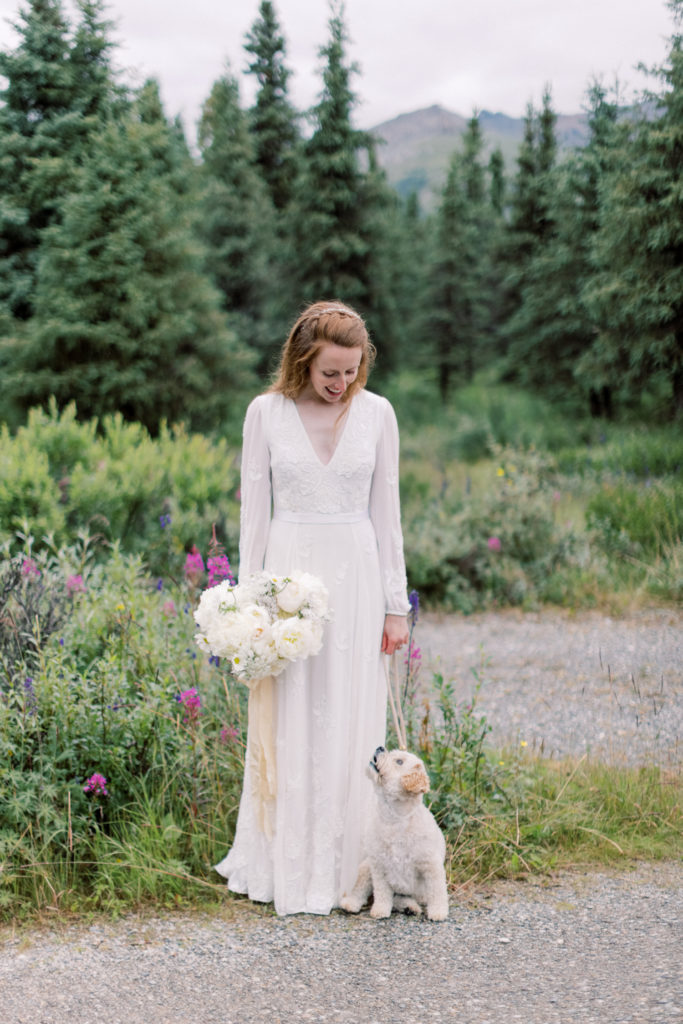 Bride with dog at her Denali National Park Wedding